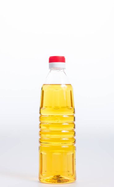 oil or oil in plastic bottle on the background. - Foto, immagini