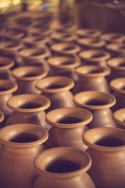 Drying handmade earthenware in rows.soft focus.Vintage color - Photo, Image