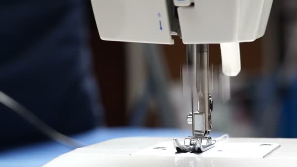 Sewing machine on the table closeup. Machine needle moves. - Footage, Video