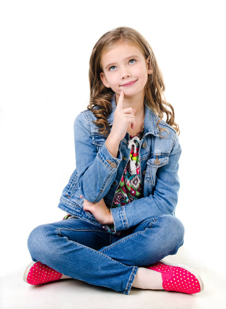 Adorable smiling  little girl sitting on a floor - Foto, afbeelding
