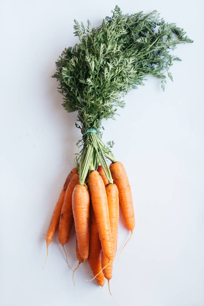 bunch of carrots on cutting board - Фото, зображення