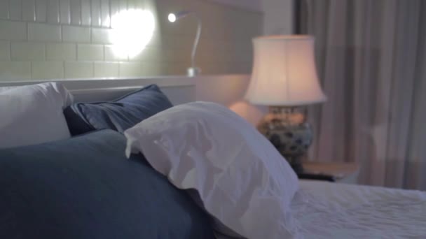 The womans going to have pillows on the bed. - Filmmaterial, Video