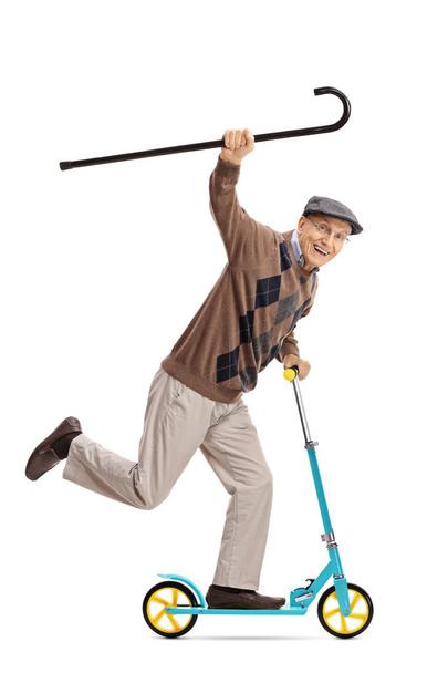 Cheerful senior riding a scooter with walking cane - Foto, imagen