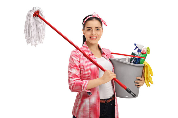 woman holding mop and bucket filled with cleaning products - Fotoğraf, Görsel