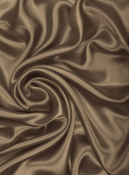 Smooth elegant golden silk or satin texture as abstract backgrou - Photo, Image