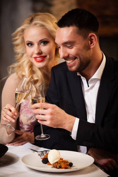 Couple celebrating in restaurant - Photo, Image