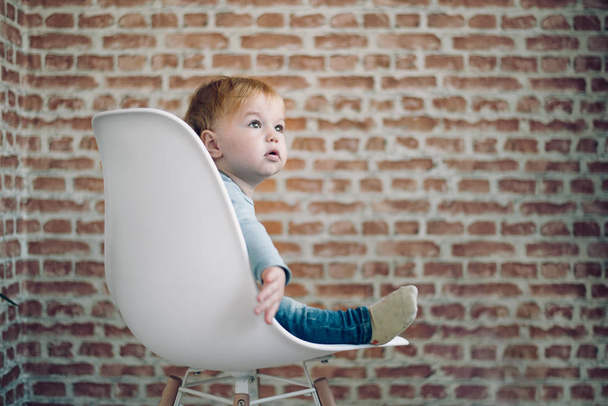 Toddler sitting in chair. - Photo, Image
