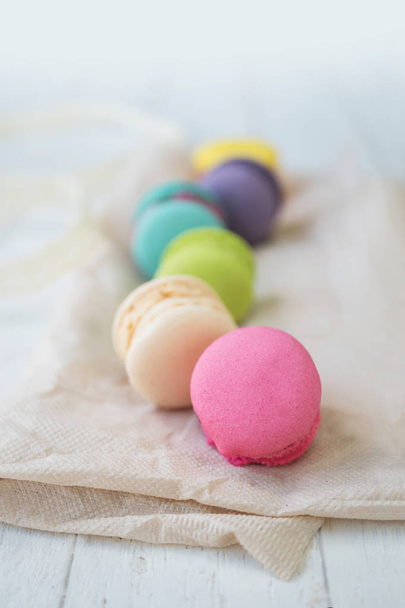Colorful macaroon set on white wood background - Foto, afbeelding