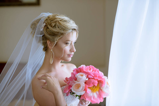 bride with bouquet indoor - Photo, Image