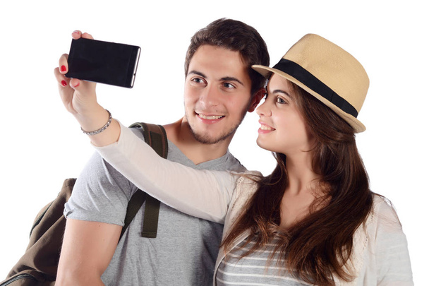Young beautiful couple on a trip and taking selfie. - Φωτογραφία, εικόνα
