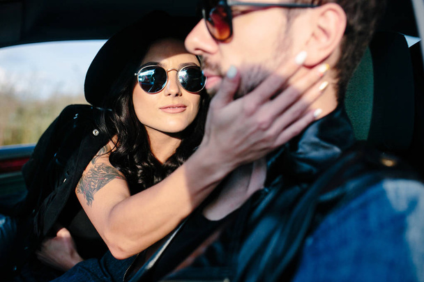 Portrait of young beautiful couple in the car - Foto, Imagem