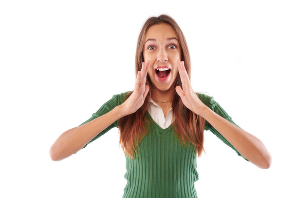 Podekscytowany młodych nastolatek krzyczy z rękami cupped wokół jej mo - Zdjęcie, obraz
