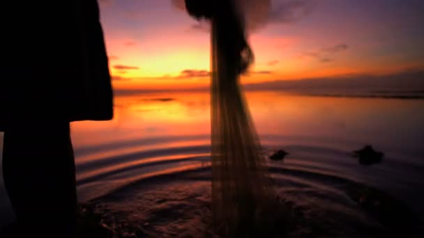 fisherman fishing on the shoreline - Footage, Video
