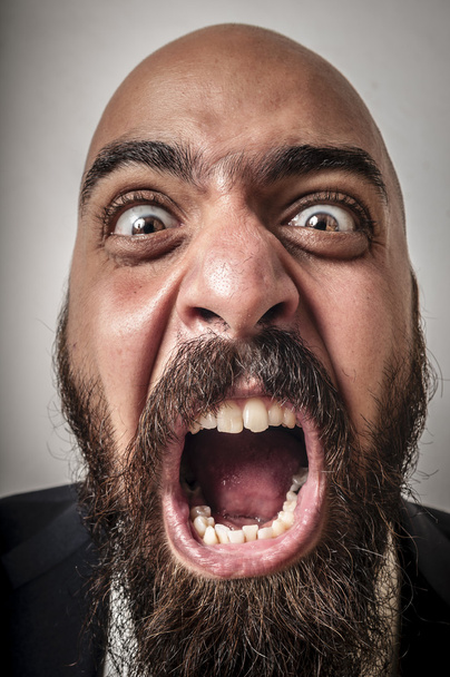 Elegant bearded man with jacket screaming - Foto, Bild