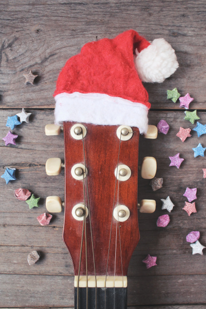 Guitar with christmas hat - Fotó, kép