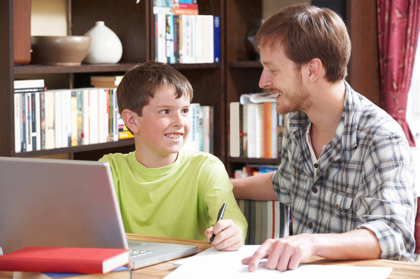 Boy Studying With Home Tutor - Фото, изображение