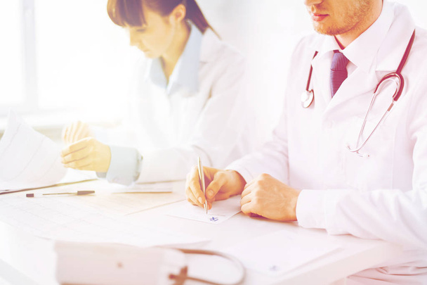 doctor and nurse writing prescription paper - Фото, изображение