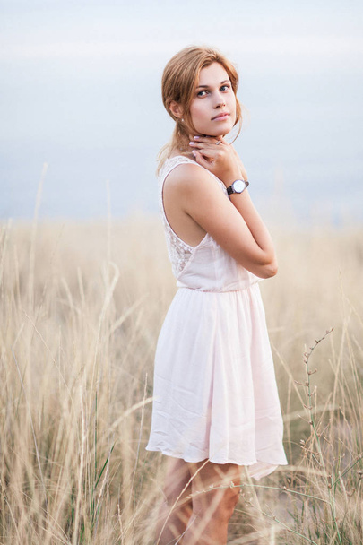 Portrait of the beautiful girl on nature - Foto, Imagen
