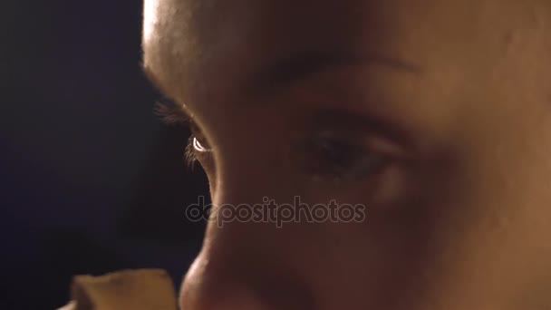 young girl using a makeup sponge deals concealer on face - Video