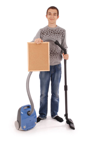 Boy holding a frame with a vacuum cleaner - Fotoğraf, Görsel