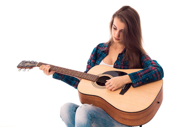 attractive girl with guitar in hands - Фото, изображение
