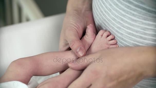 Mom Hands Foot Massage Her Newborn Baby - Footage, Video
