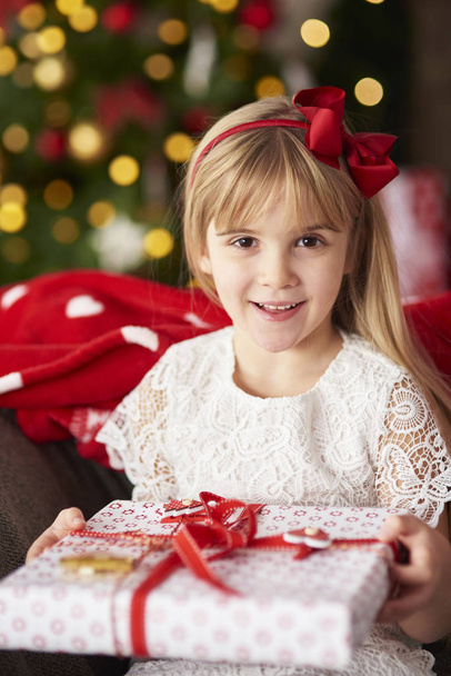 little blond girl holding gift - Photo, Image