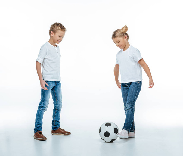 Smiling children playing with soccer ball - Fotoğraf, Görsel