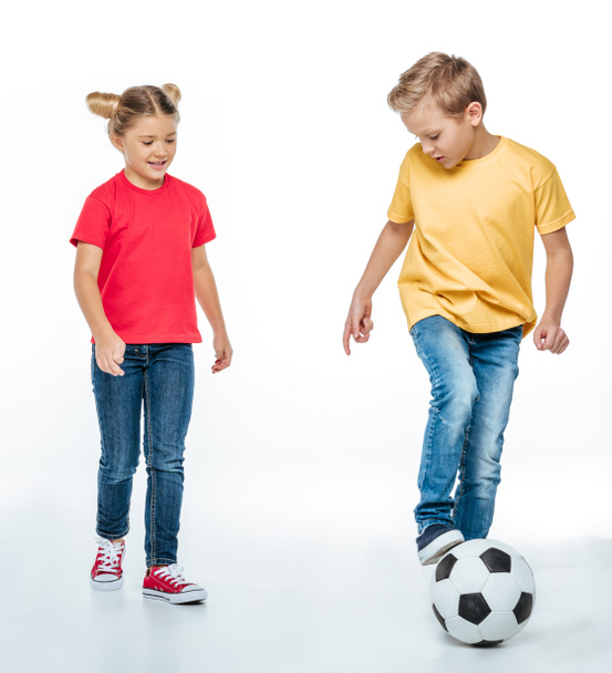 siblings playing with soccer ball - Фото, зображення