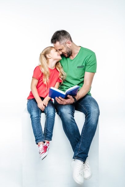 father and daughter sitting with book - Fotografie, Obrázek