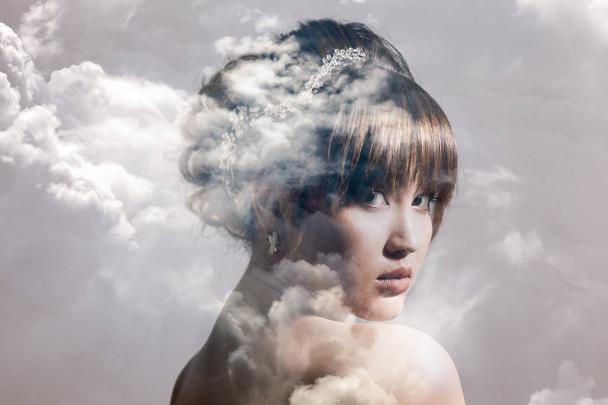 Double exposure of gorgeous bride portrait and cloudscape - Fotografie, Obrázek