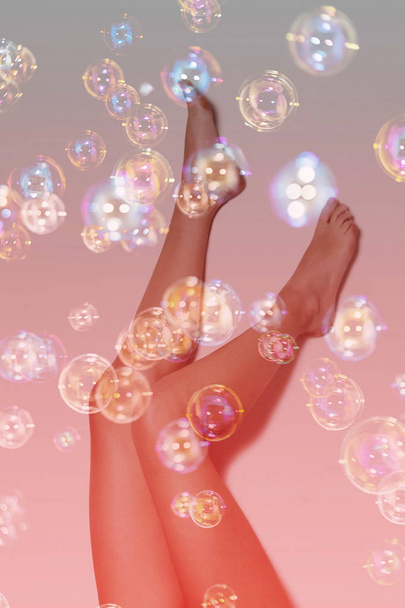 Double exposure of girl legs and soap bubbles - Fotó, kép