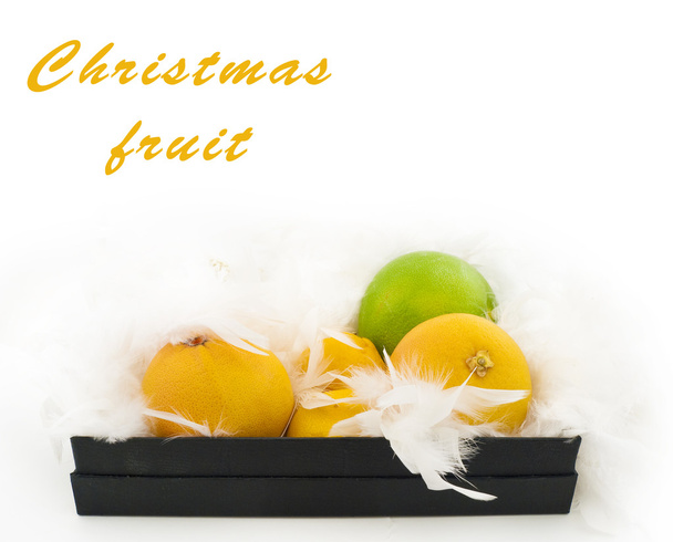 Christmas fruit in a black box - Photo, Image