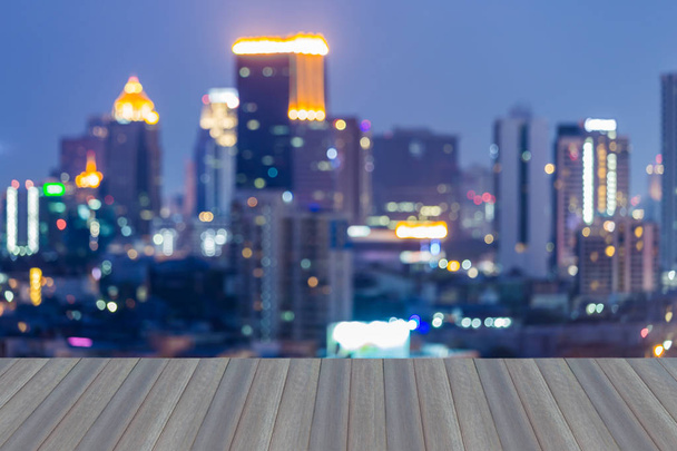 Opening wooden floor, Blurred lights cityscape - Photo, Image