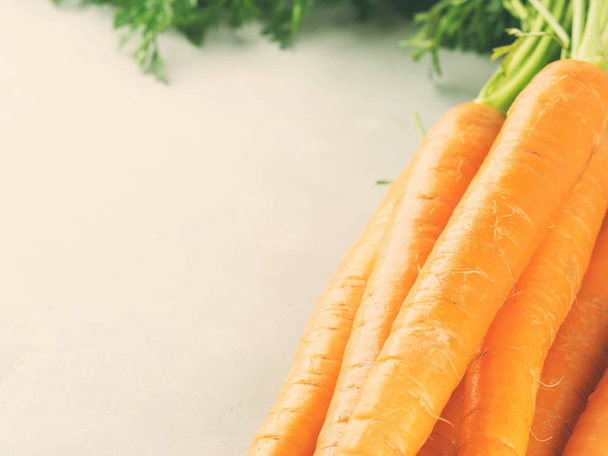Свежая морковь на сером фоне. Toned
 - Фото, изображение