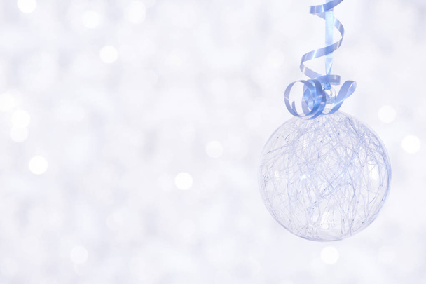Beautiful shiny ball on a winter background - Fotó, kép