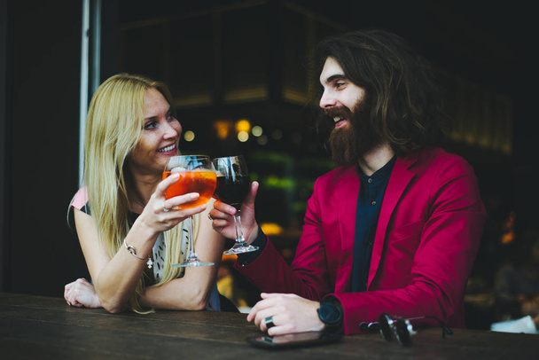 Cheerful couple in cocktail bar - Photo, image