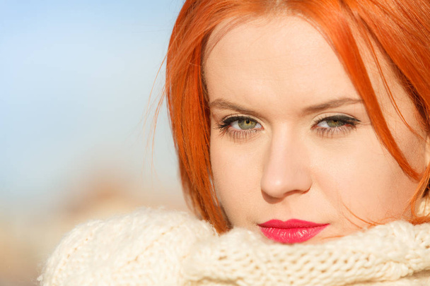 Beauty face red hair woman in warm clothing outdoor - Foto, Imagem