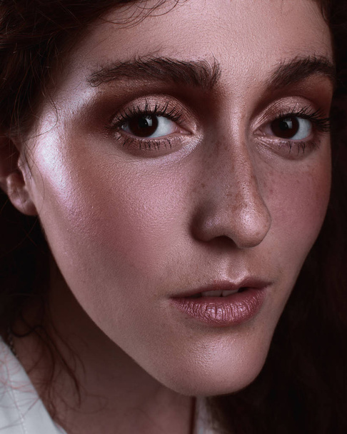 Portrait of a beautiful girl with freckles and light wear make up - Photo, Image