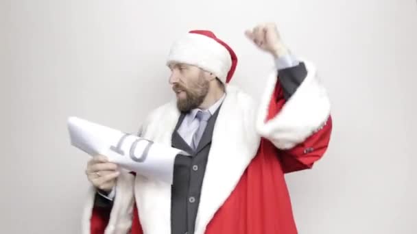 businessman in a suit of Santa Claus smiling and funny dancing, - Filmagem, Vídeo