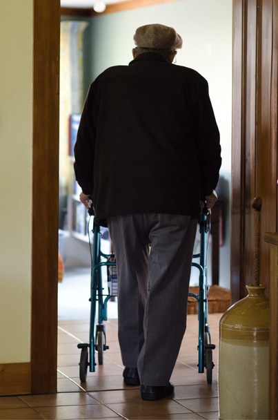 Elderly man use a walker (walking frame) - Valokuva, kuva