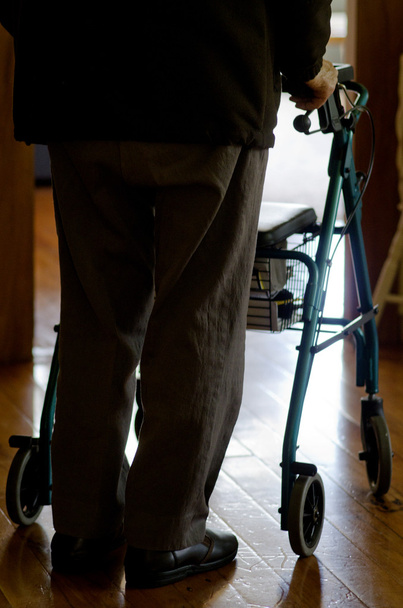 Elderly man use a walker (walking frame) - Photo, image