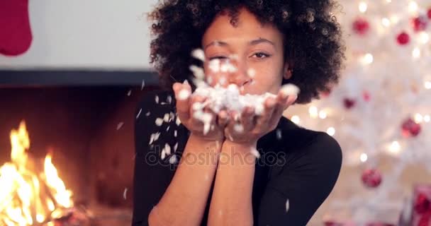 Adorable sexy woman blowing out confetti - Footage, Video