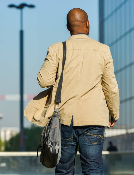 La defense, France- April 10, 2014: back view of businessman walking in a street - Photo, Image