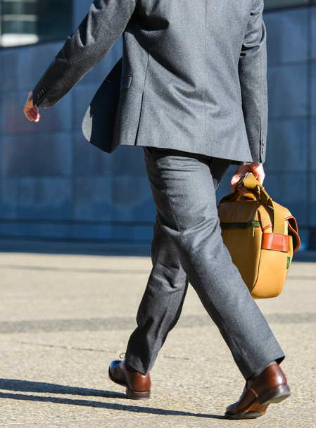 La defense, France- April 10, 2014: side view of businessman walking in a street - Fotoğraf, Görsel