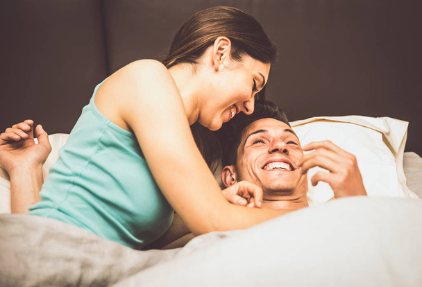 Couple having fun in bed - Foto, immagini