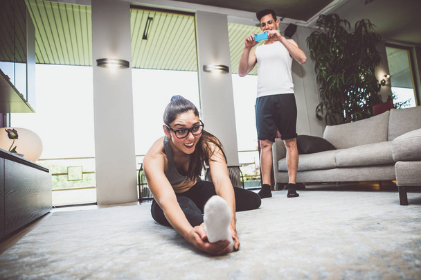 Couple making fitness at home - Fotoğraf, Görsel