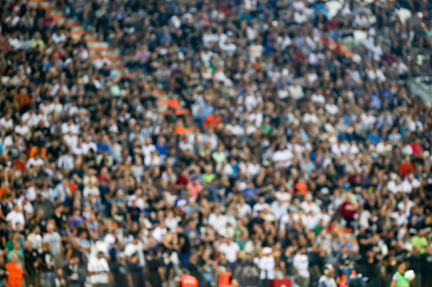 verschwommene Zuschauermenge auf einer Stadiontribüne bei einer Sportveranstaltung - Foto, Bild