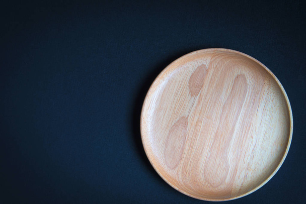 Wood plate on wooden table - Photo, Image