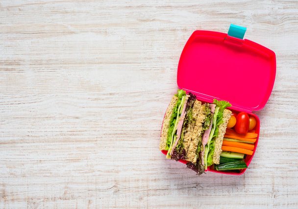 Pink Lunch Box with Sandwich and Copy Space - Fotografie, Obrázek